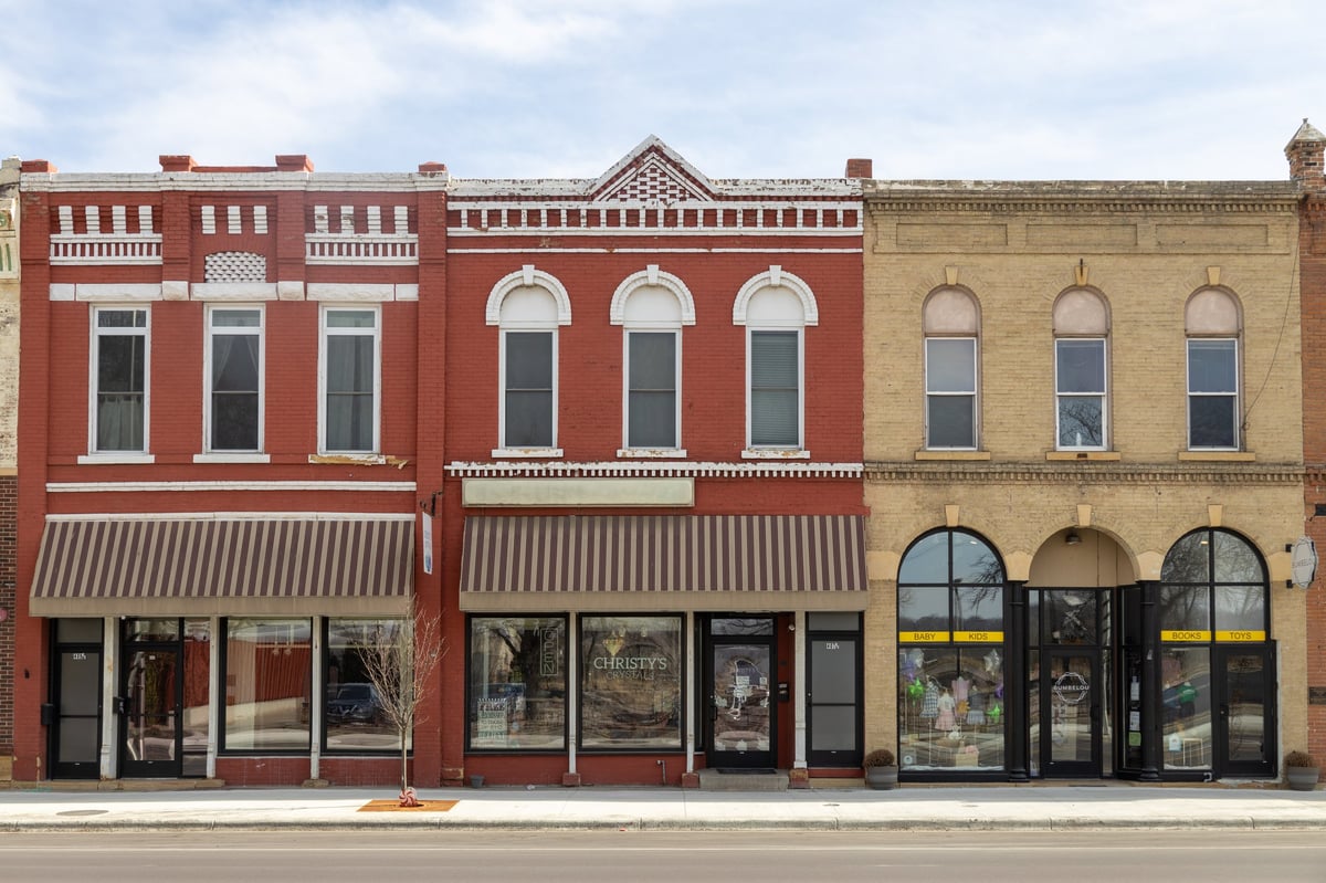 Historic downtown streetscape with brick buildings and storefronts
