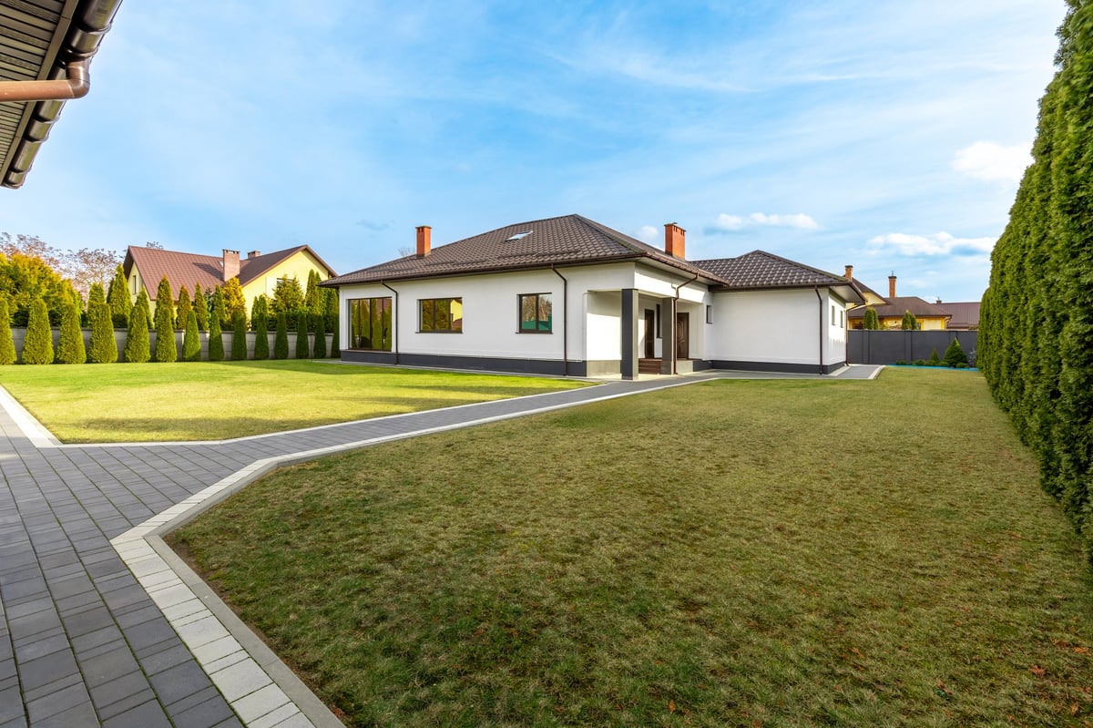 Property owner reviewing sell, refinance, or hold options for a campus-area rental home with advisor