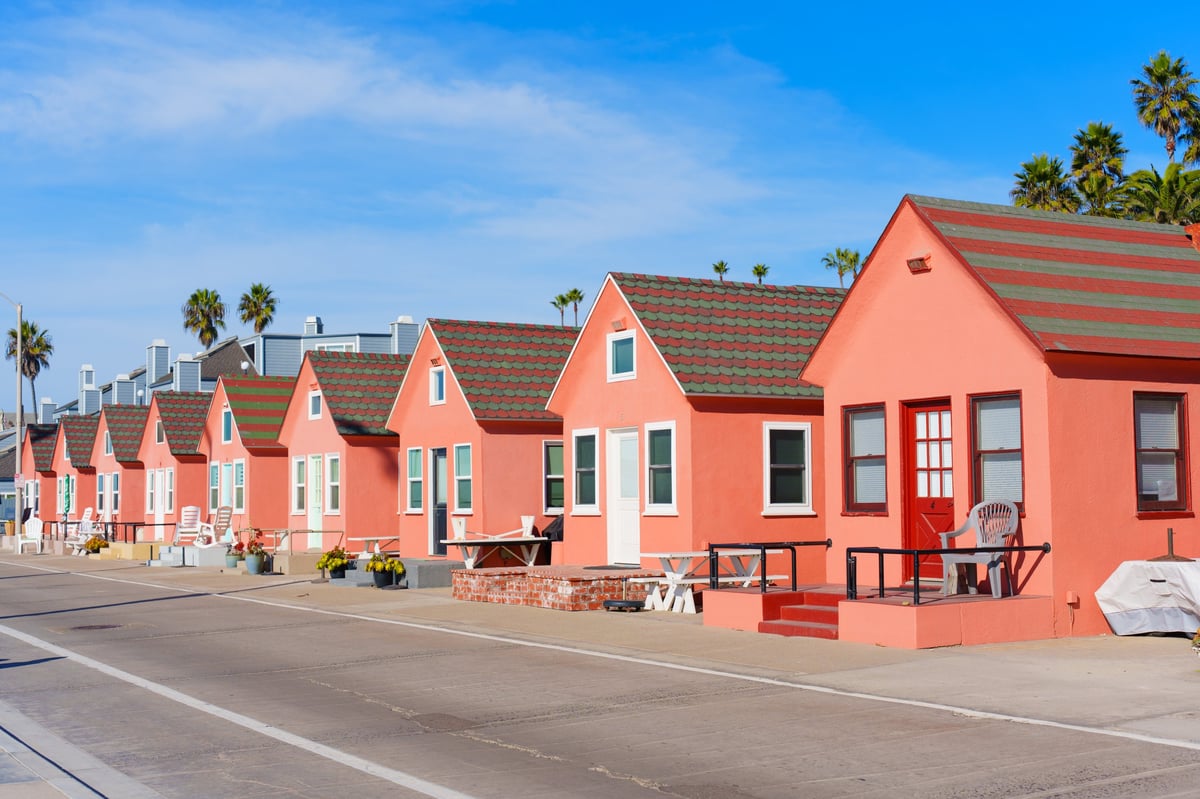 Homes along a coastal road with waterfront setting