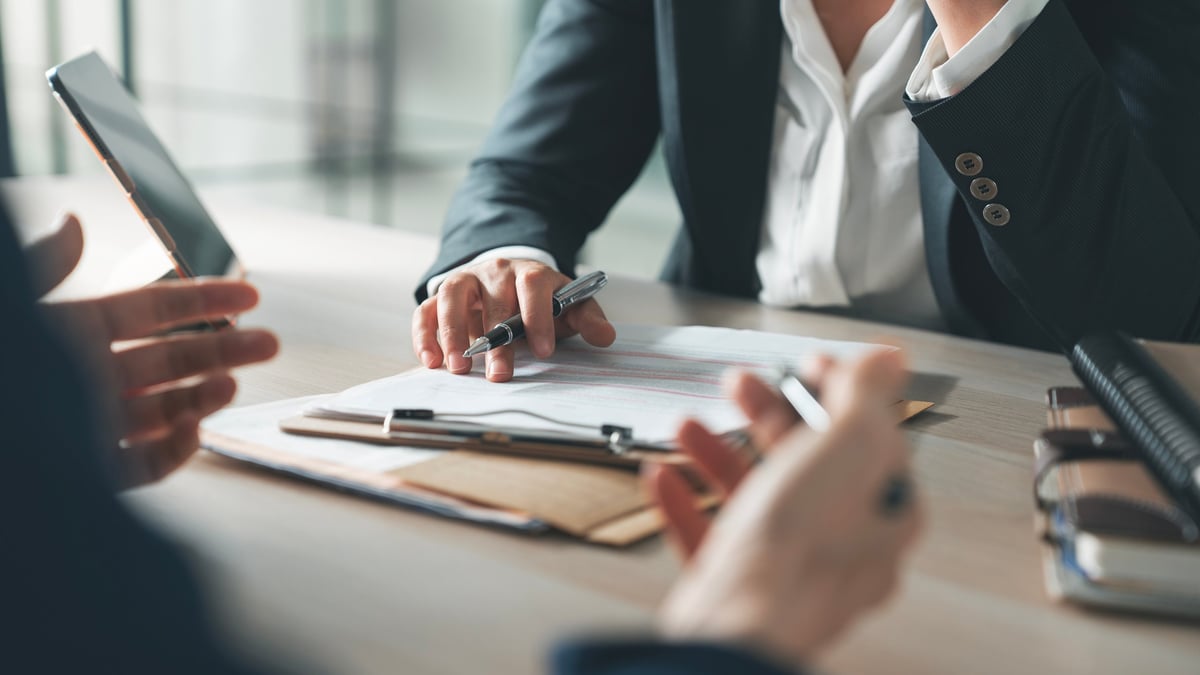 Loan officer reviewing campus-area property financing