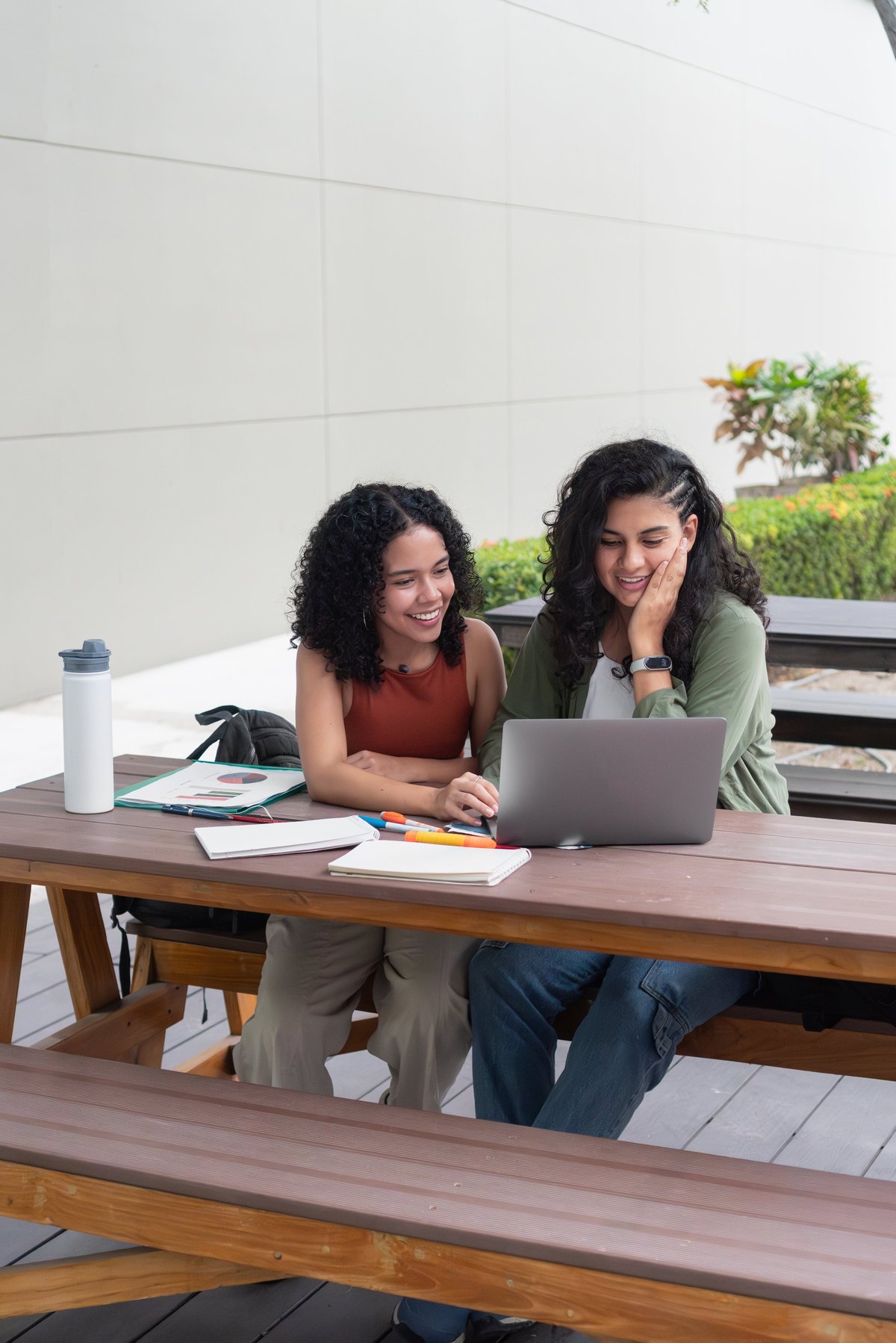 College roommates collaborating in a clean shared off-campus living space near Florida State University