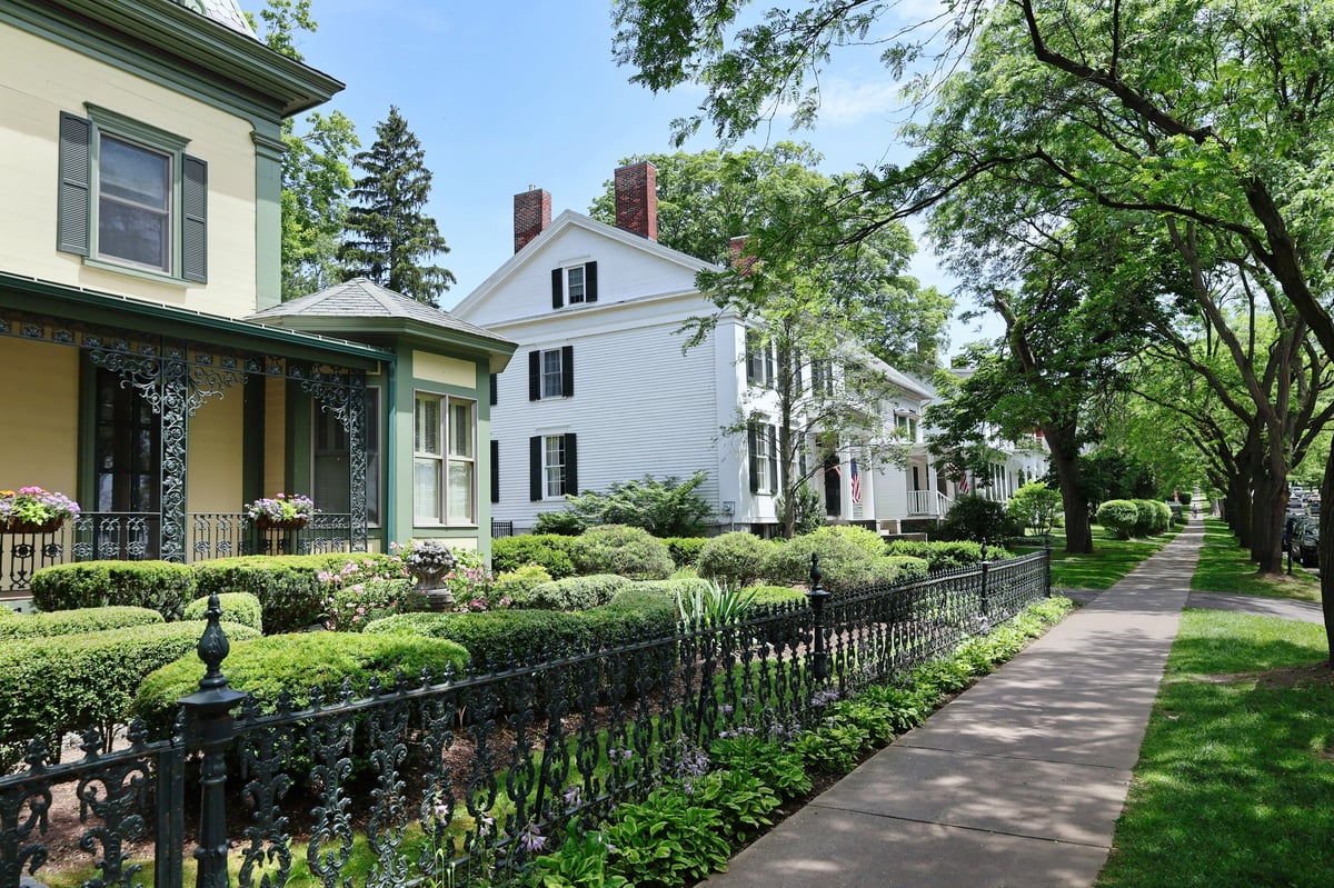 Historic craftsman homes on a tree-lined street in a walkable neighborhood