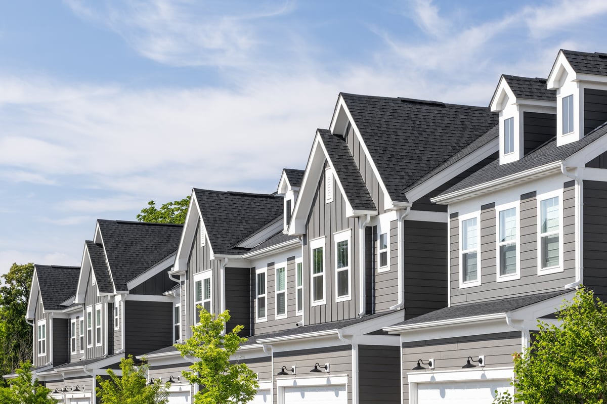 Parent reviewing a campus-area housing purchase near a major university