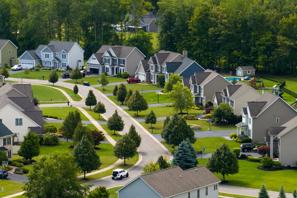 View from above of residential houses in suburban living area
