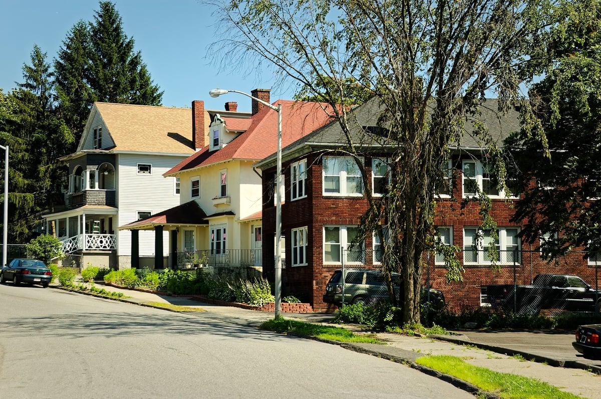 Historic Victorian-style homes with wrap-around porches near campus
