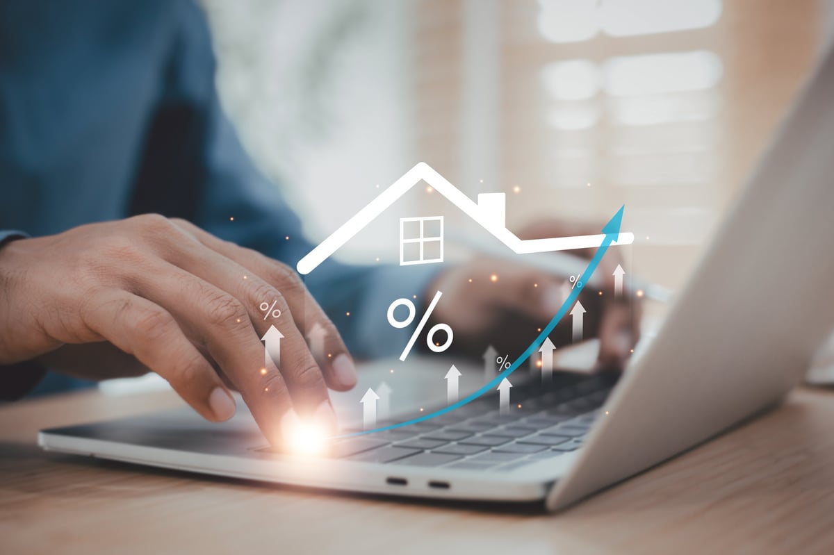 Investor reviewing campus-area rental property cash flow projections on a clean desk with calculator