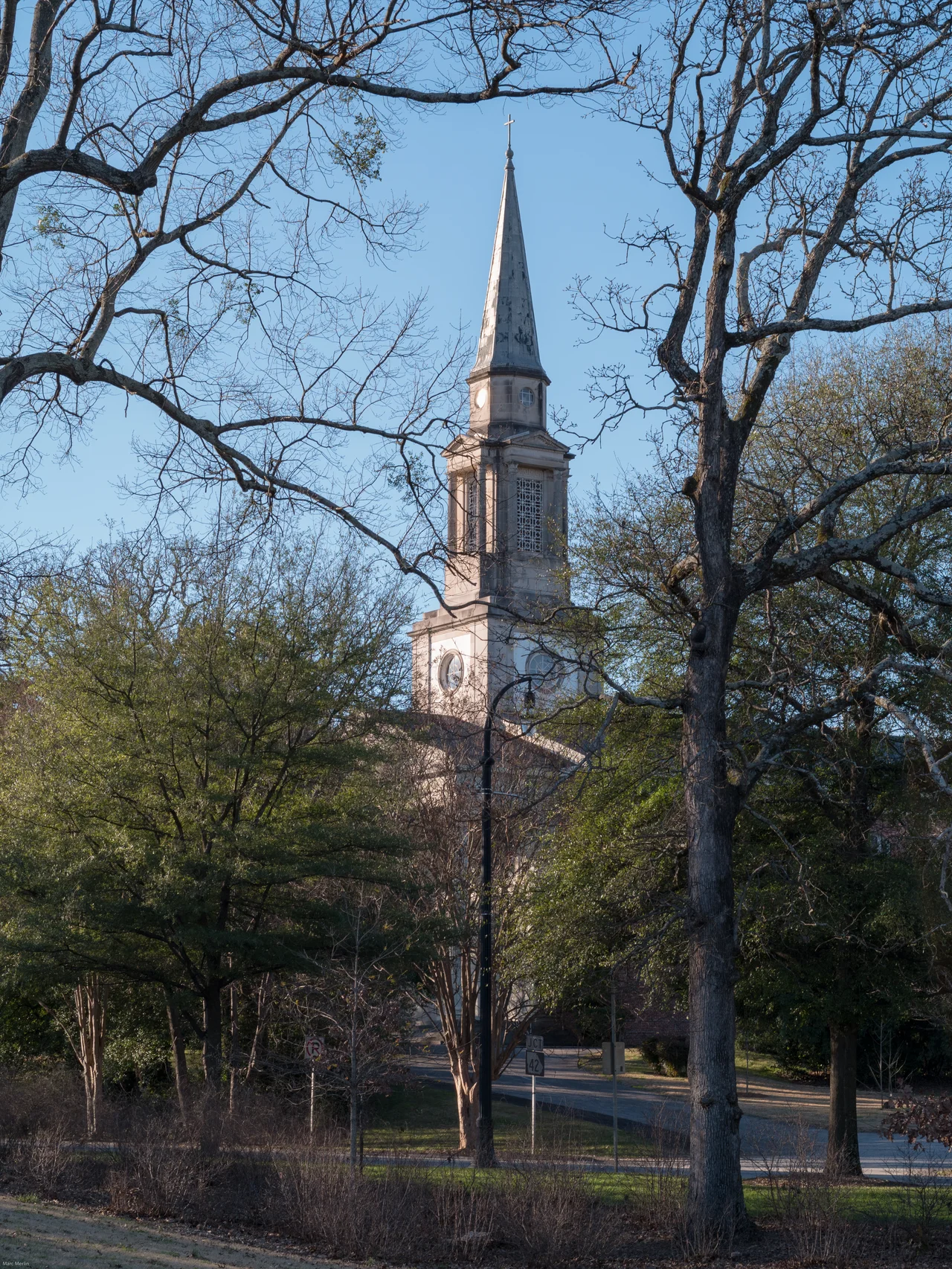 The Druid Hills United Methodist Church steeple is visible through trees from Springdale Park.