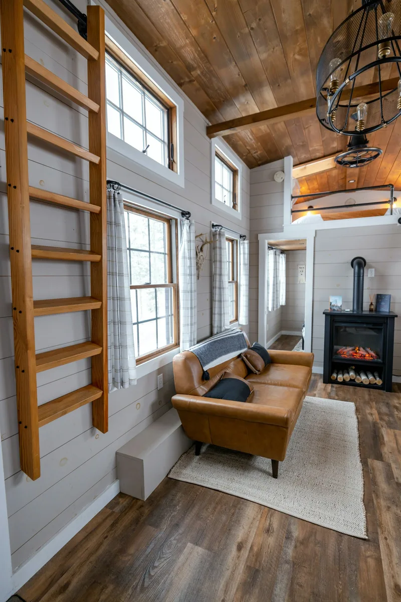 A contemporary living room with a couch and fireplace. Illustrative photography, not a local listing.