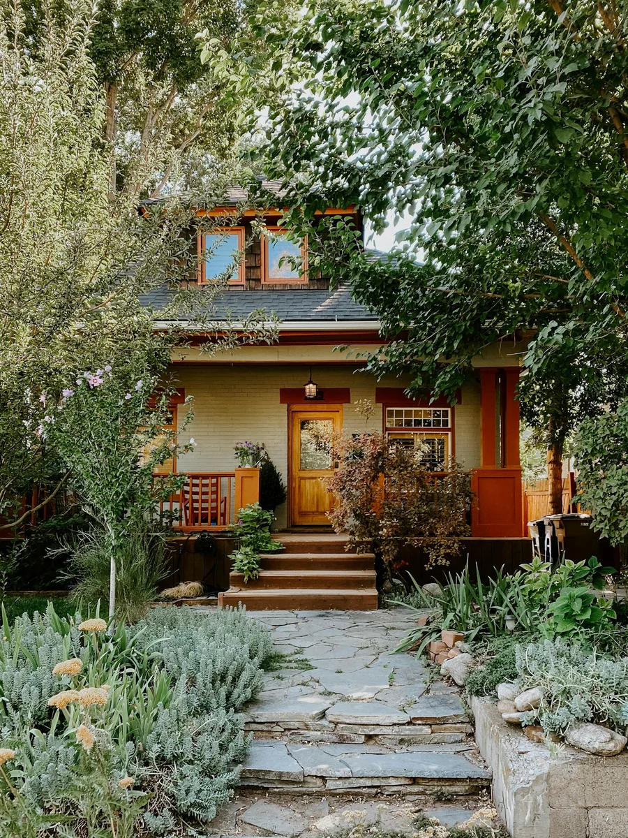 A landscaped path leading to a bungalow entrance. Illustrative photography, not a local listing.