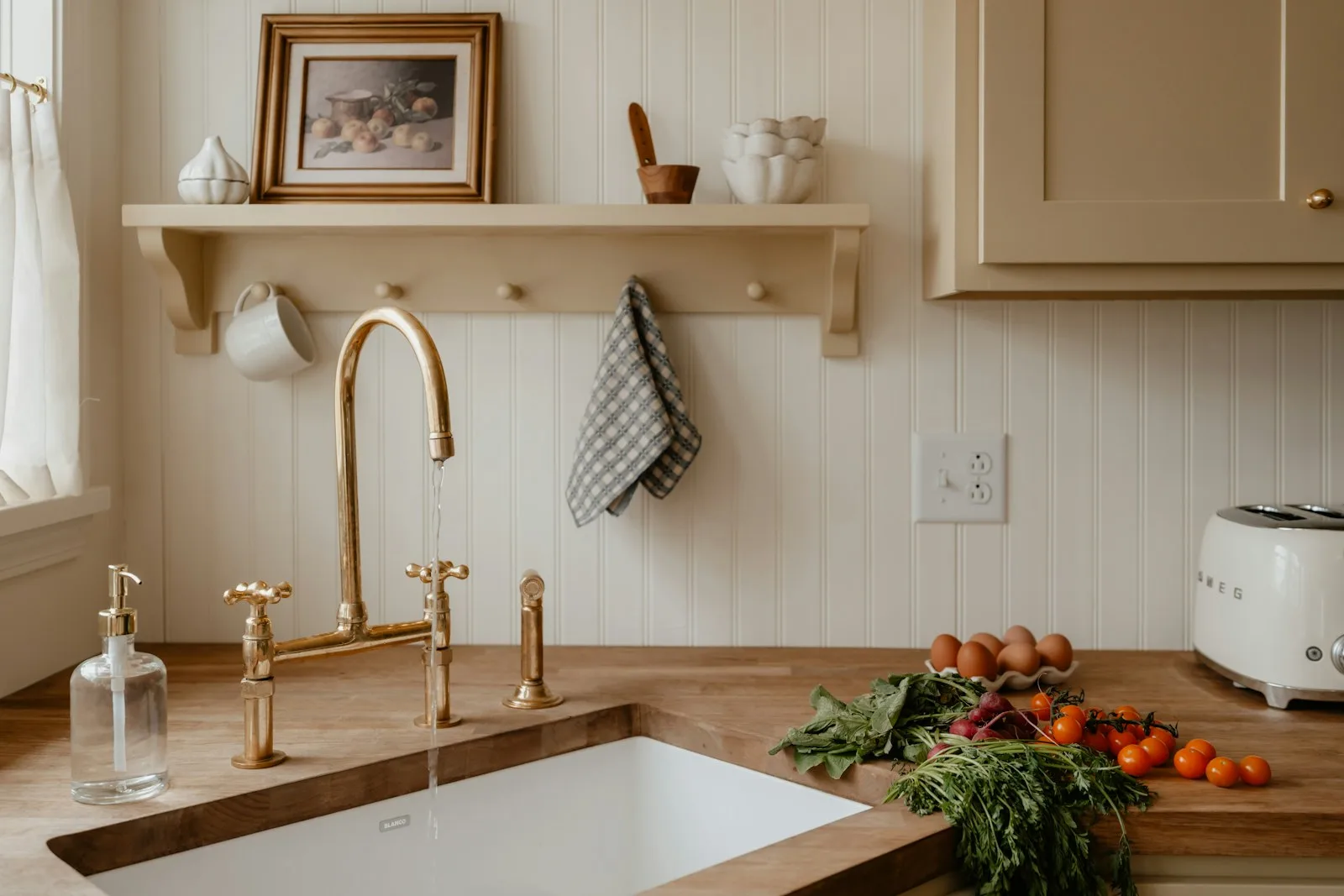 A kitchen sink, faucet and countertop with groceries. Illustrative photography, not a local listing.