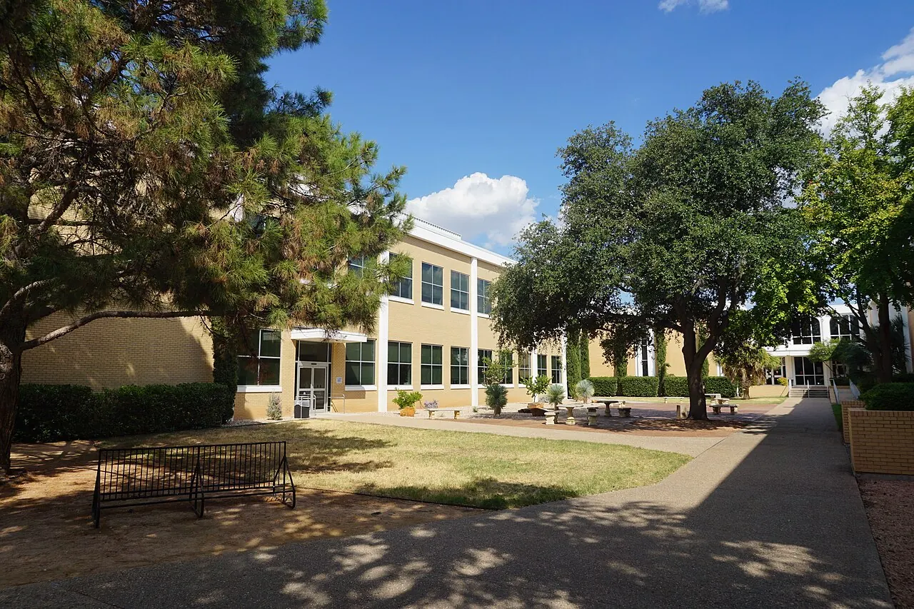 Cavness Science Building and the landscaped campus walk at Angelo State University.