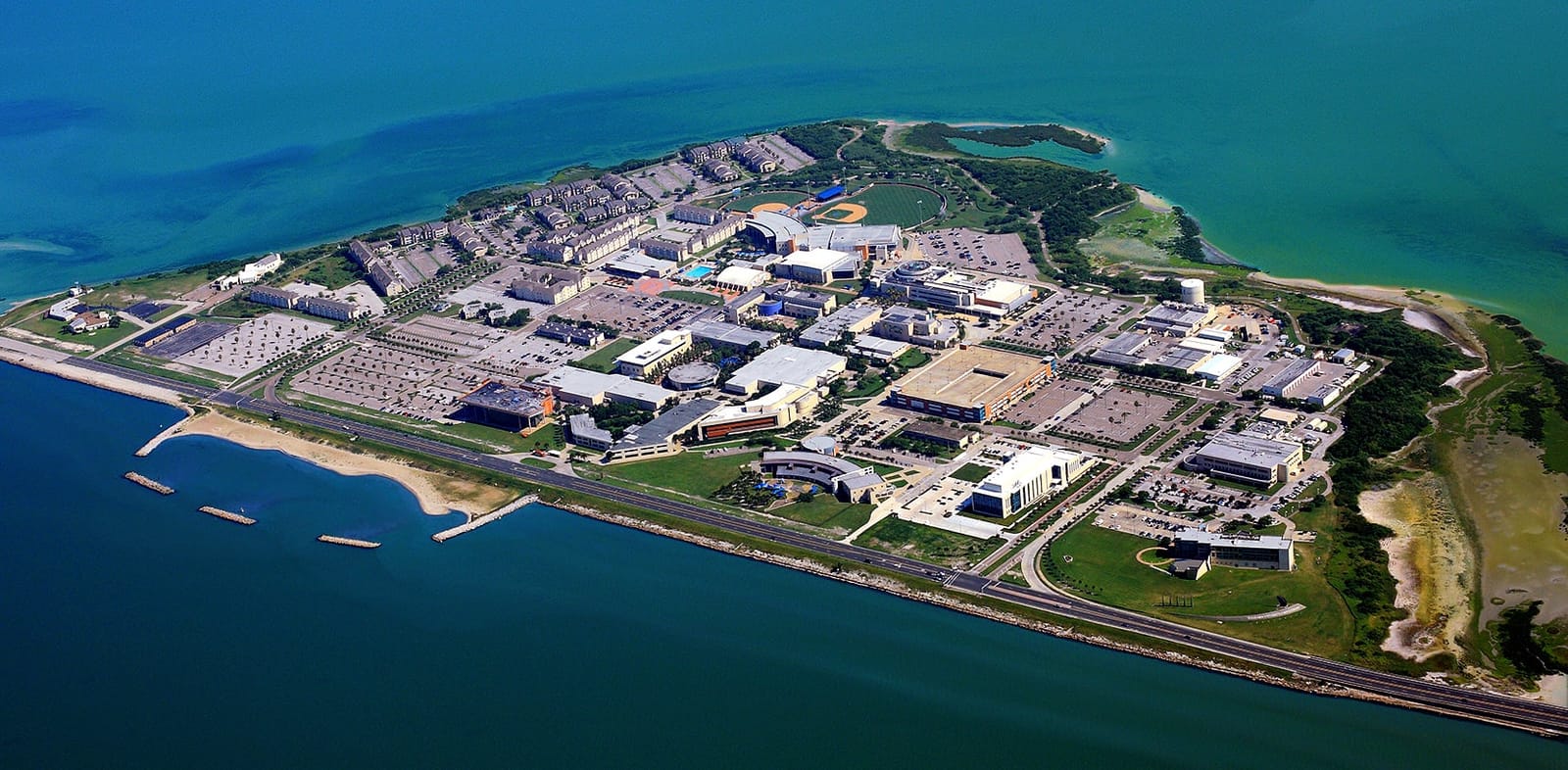 Aerial view of the Texas A&M University–Corpus Christi island campus and surrounding bay